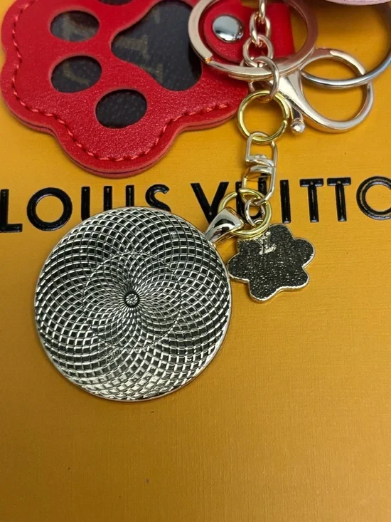 Louis Vuitton Monogram Disc,
Pink Leather Dog/Paw Bag Charm, LV charm
6.5 in. - Picture 6 of 6